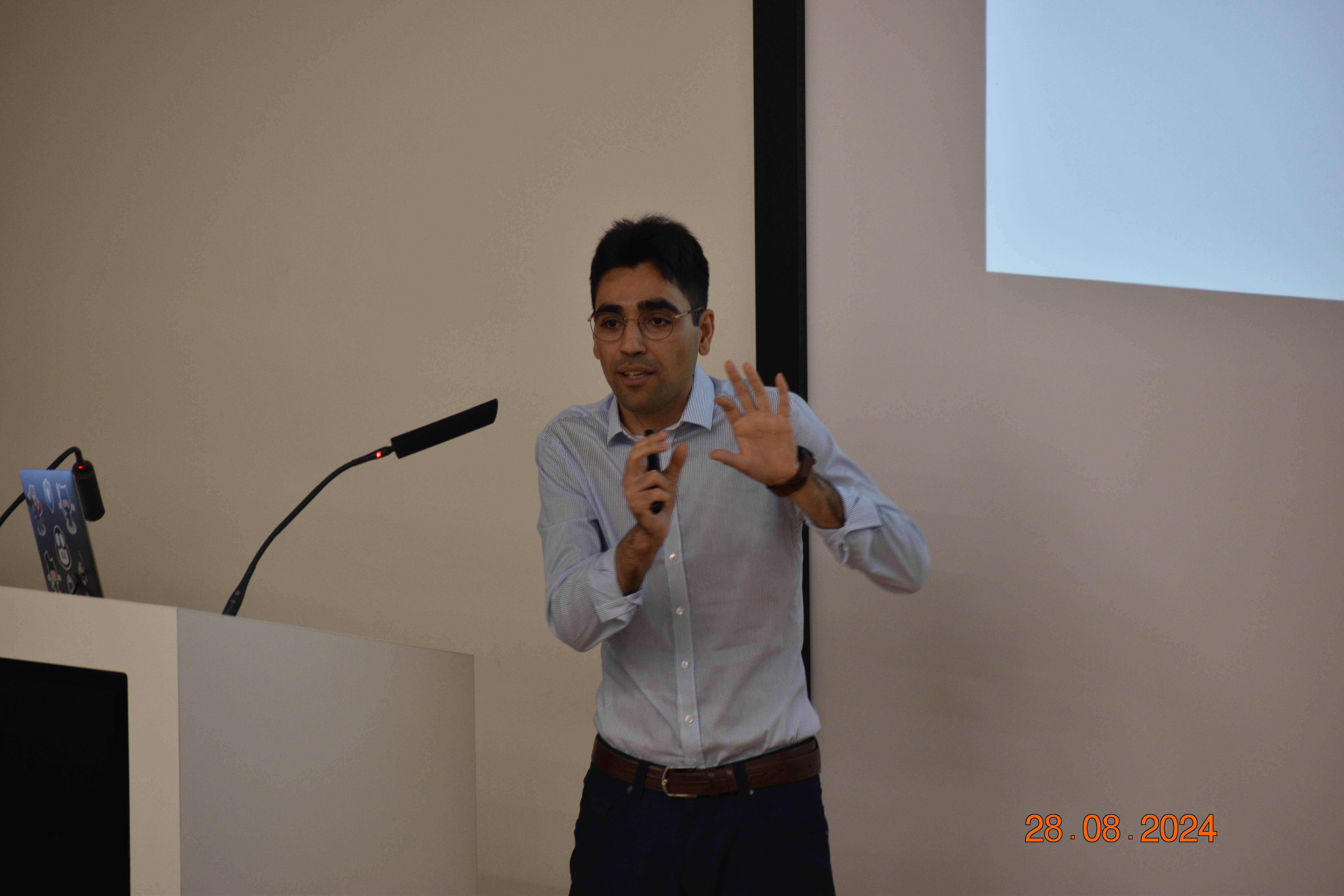 Soheil Khodayari on stage presenting his work at CISPA.