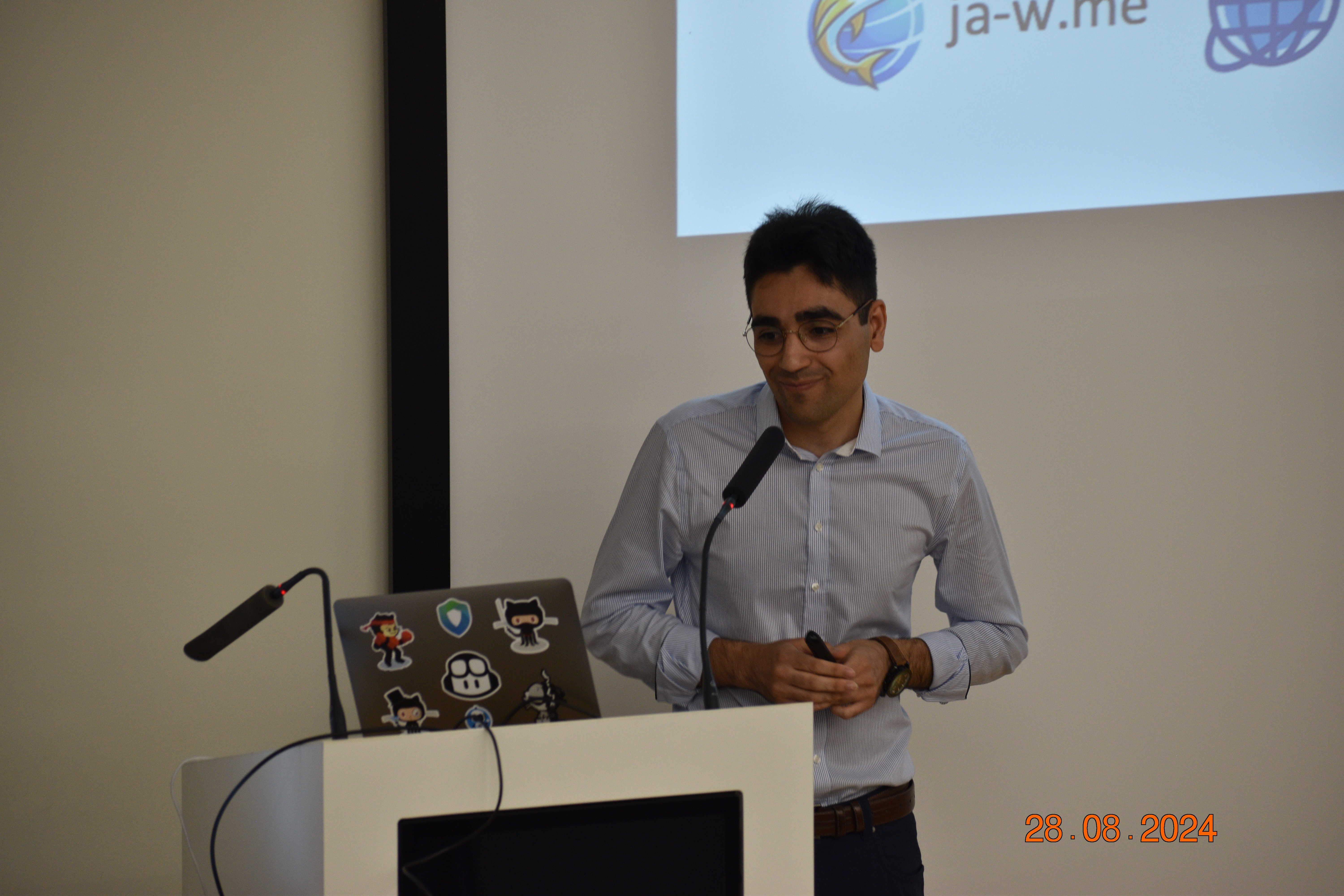 Soheil Khodayari on stage presenting his work at CISPA.